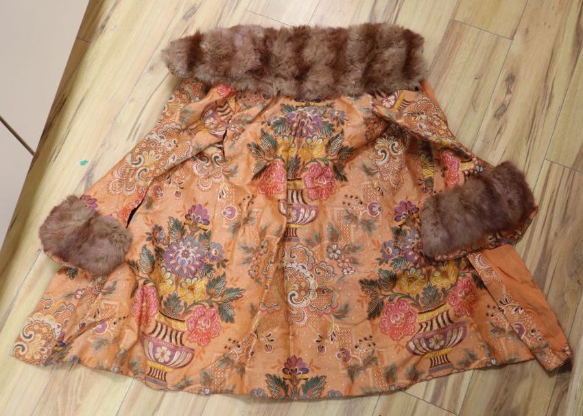 A 1930s orange brocade floral fur trimmed coat label Delia, 99 New Bond Street